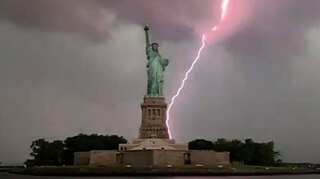 Man captures exact moment lightning strikes Statue of Liberty; footage goes viral