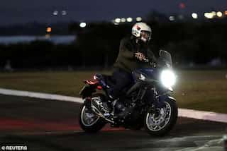 Despite being COVID positive, Bolsonaro rides motorcycle, chats up workers