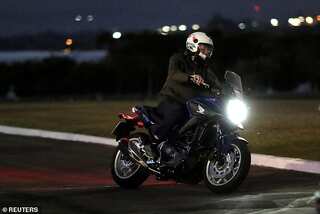 Despite being COVID positive, Bolsonaro rides motorcycle, chats up workers