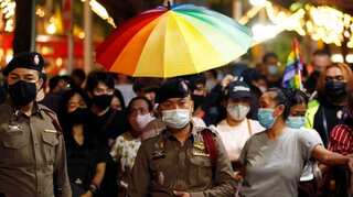 Thai LGBT activists raise pride flag in anti-government rally