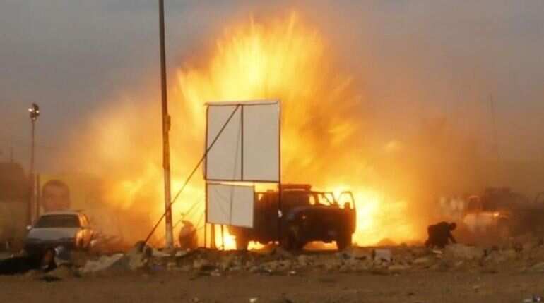 Explosion hits southern Baghdad weapons depot, blamed on heat