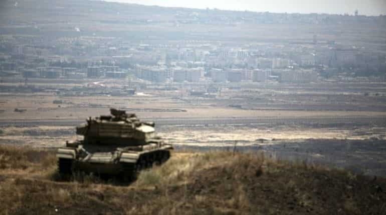Israel hits squad that placed explosives along Syria frontier, army says Israel hits squad that placed explosives along Syria frontier, army says