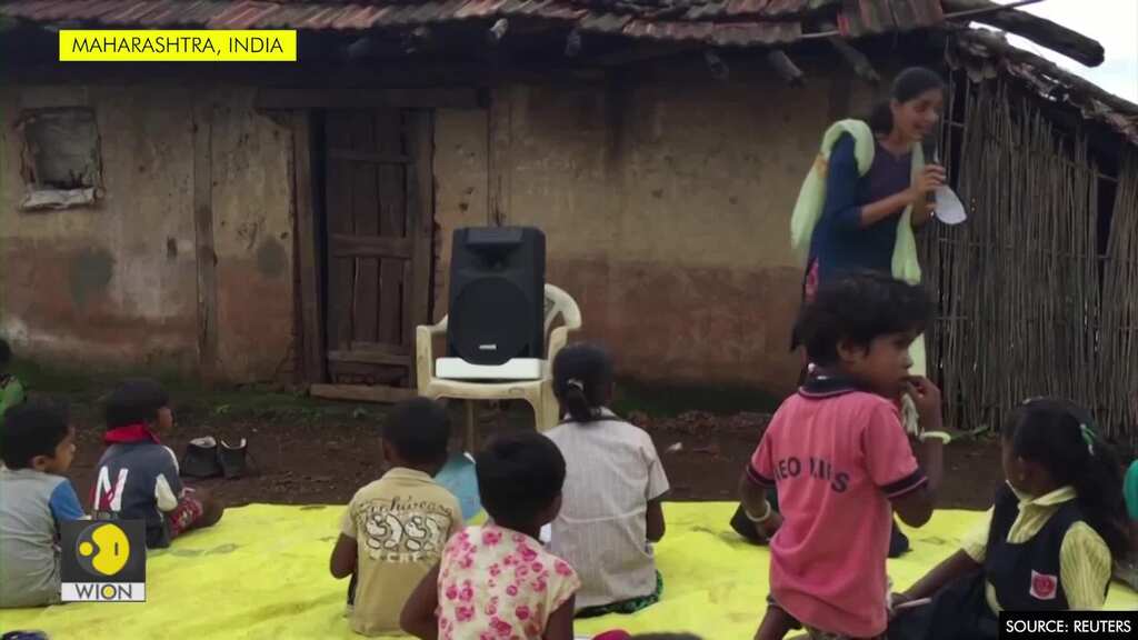 With schools closed due to COVID-19, children gather for lessons over loudspeaker