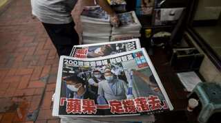 Hong Kong police arrest another Apple Daily editor under China national security law 