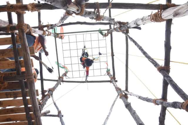 Suspended upside down at 20 feet, 5-year-old performs daring archery feat