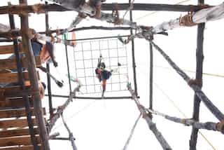 Suspended upside down at 20 feet, 5-year-old performs daring archery feat