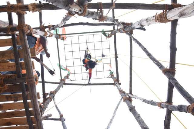 Suspended upside down at 20 feet, 5-year-old performs daring archery feat