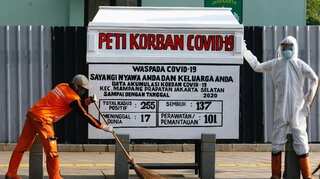 Jakarta displays 'dummy coffin' to raise awareness about dangers of coronavirus