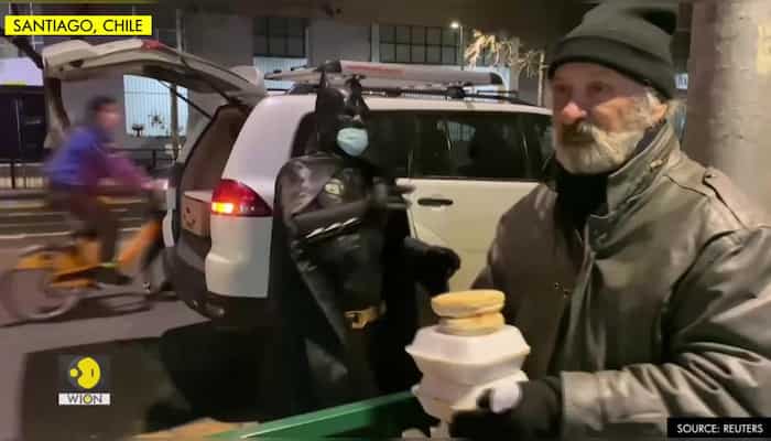 "Batman" prowls streets of Santiago delivering food to homeless
