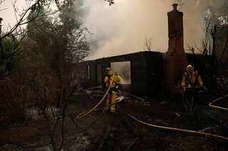 Rains help douse California wildfire; firefighter loses his life
