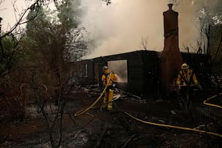 Lightning-sparked fires rage across California, tens of thousands flee
