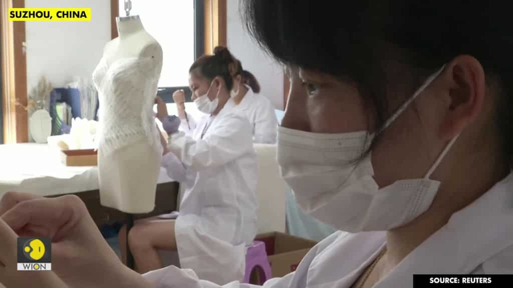 Coronavirus dampens celebrations in China's wedding gown city