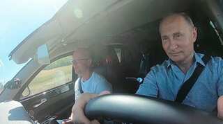 Putin drives car in annexed Crimea during rare trip outside Moscow