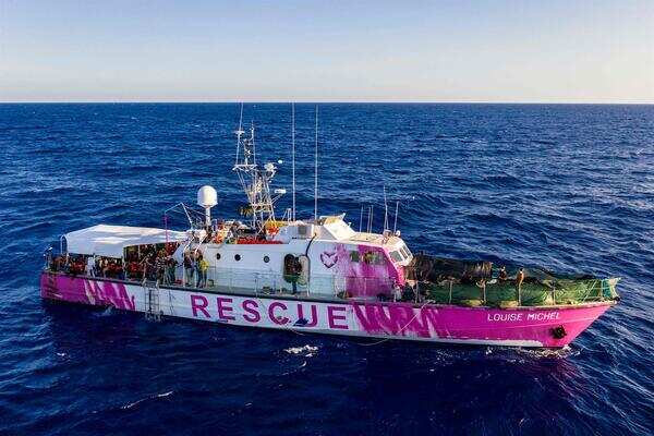 All migrants moved off Banksy-funded rescue vessel stranded in Mediterranean All migrants moved off Banksy-funded rescue vessel stranded in Mediterranean