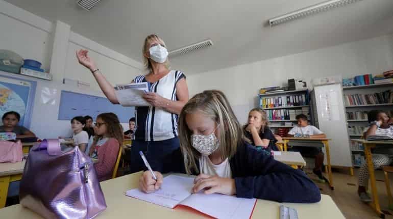 Texts books and face masks, Europe's children return to school Texts books and face masks, Europe's children return to school