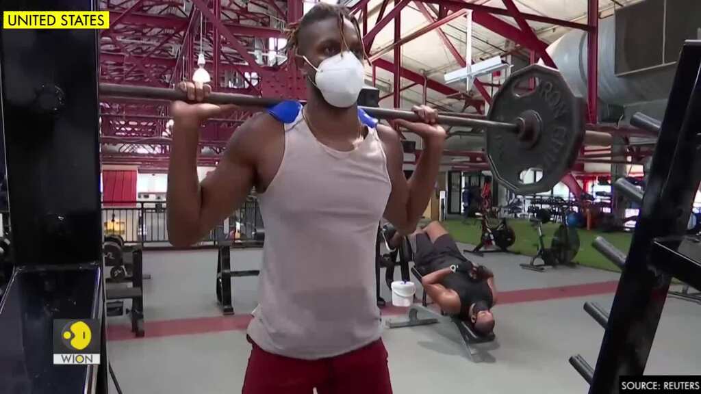 New Yorkers pant through masks as gyms reopen with new safety measures
