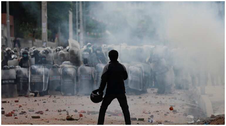 Nepal police fire tear gas to stop religious rally amid COVID-19 surge
