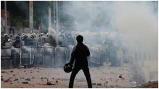 Nepal police fire tear gas to stop religious rally amid COVID-19 surge