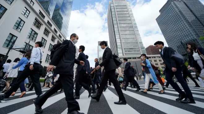 Japan's economy sinks deeper, businesses delay fresh investments