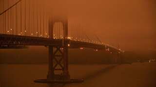 At least six die in wildfires as orange skies blacken US