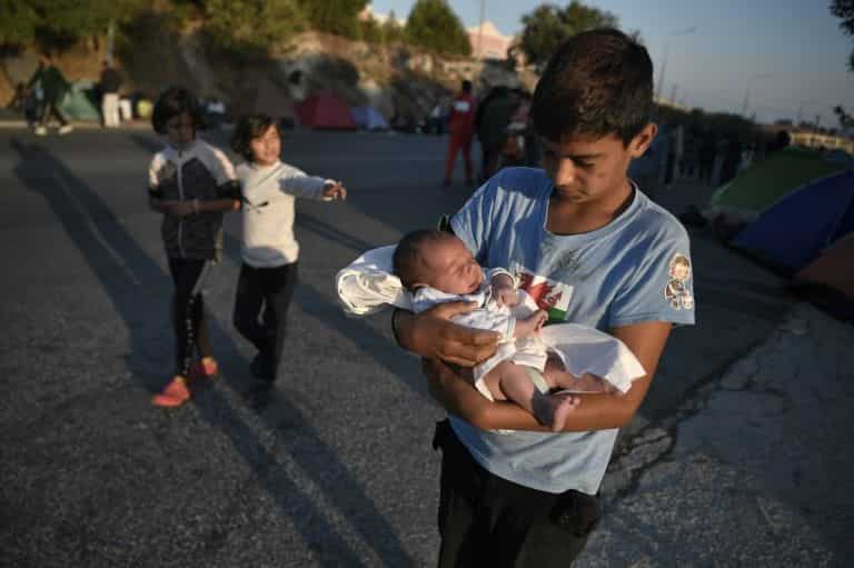 Greece ramps up emergency effort after Lesbos migrant camp fire, locals oppose plans