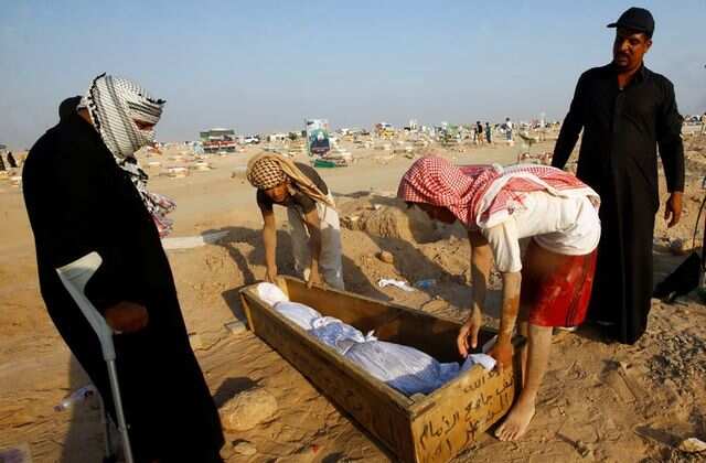 Iraqis flock to COVID cemetery to exhume dead, re-bury elsewhere