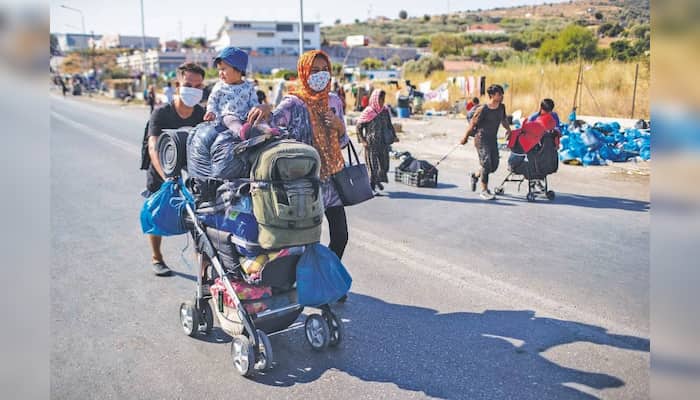 Migrants moved to new camp on Lesbos after fire burnt Moria Camp