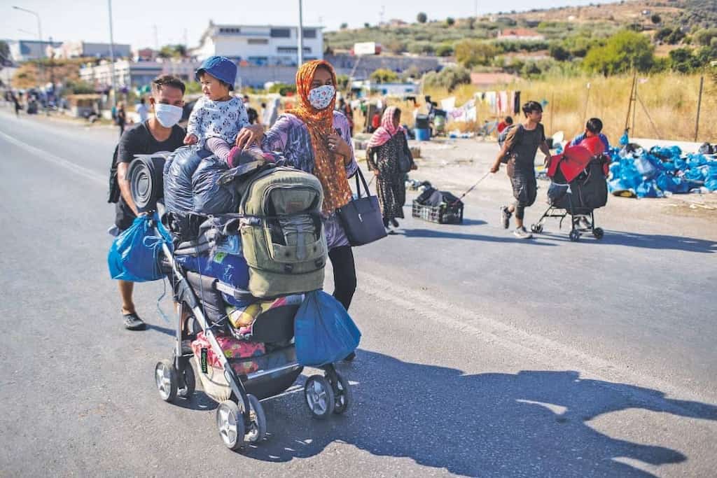 Migrants moved to new camp on Lesbos after fire burnt Moria Camp