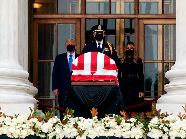 Donald Trump booed as he pays respect to Ginsburg at court