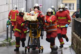Paris cleaver attack suspect says acted over Charlie Hebdo cartoons, sources say