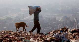 Rescuers dig through Indian trash dump for 12-year-old 'rag picker'