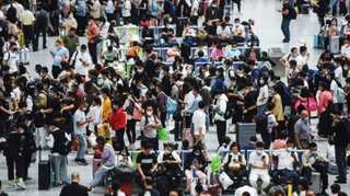 Millions on the move as China eyes holiday bounce amid pandemic