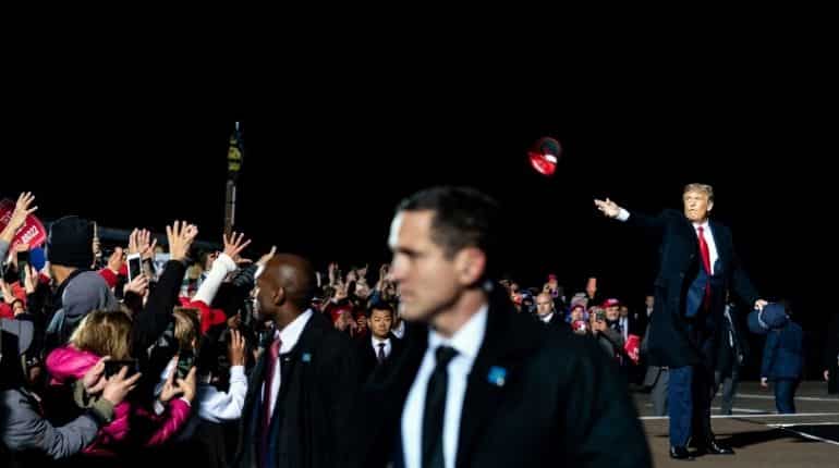 Trump throws his cap into the crowd