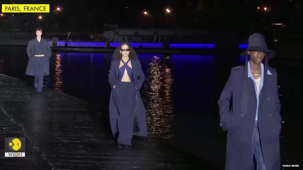 Parisian label AMI parades models by the Seine for fashion week