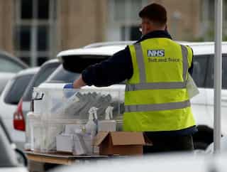 Britain opens investigation into coronavirus test and trace glitch