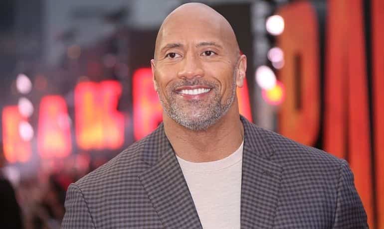 Dwayne Johnson reacts to his Macy's Thanksgiving parade balloon