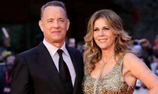 Watch: Tom Hanks yells at fans as wife Rita trips while exiting an NYC building: Back the f*** off