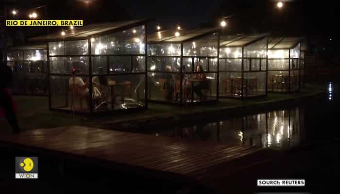 Brazil restaurant installs glass cabins to shield diners from virus