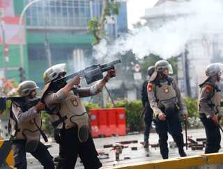 Clashes erupt in protests against new Indonesian jobs law