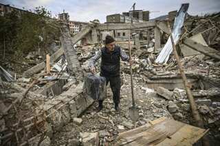 In war-hit Karabakh capital, residents inspect destroyed homes