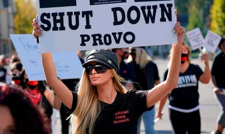 Paris Hilton leads protests outside the school where she was abused, calls for closure