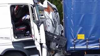 Van driver survives with minor injuries after vehicle sandwiched between two trucks