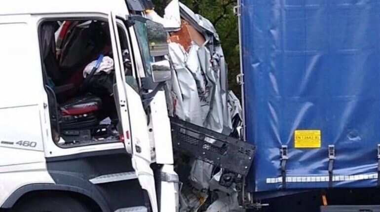 Van driver survives with minor injuries after vehicle sandwiched between two trucks