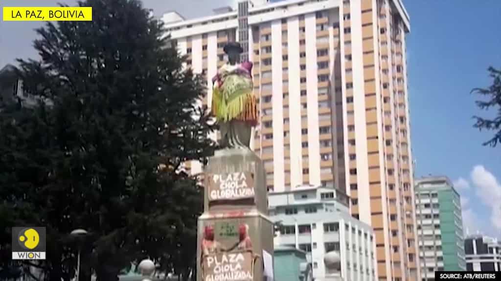 Feminists dress statue of Isabel la Catolica as 'cholita;' Columbus statue is vandalised