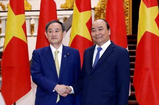 Japanese PM Suga arrives in Vietnam on first foreign visit amid tensions with China