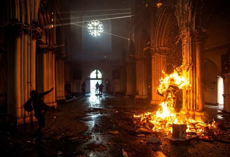 Churches burnt as thousands mark Chile protest movement anniversary
