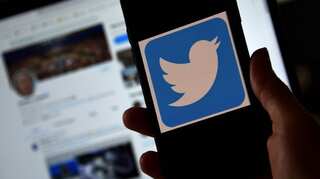 Twitter suspends 70,000 QAnon-related accounts; Trump supporters plan 'flop' protest