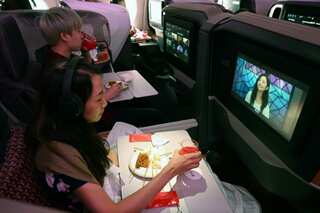 Travel-starved 'passengers' dine on parked Singapore Airlines jet