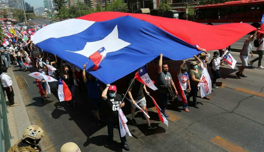 Authorities sanitize polling stations as Chile goes to polls after protests