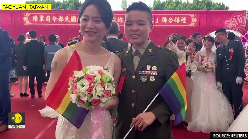 'Coming out bravely'- Taiwan same-sex couples join military wedding for first time